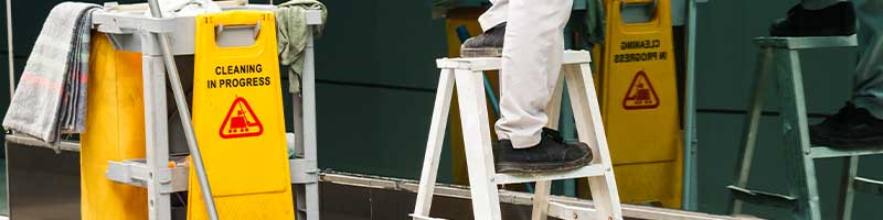 closeup shot of a man standing on a ladder
